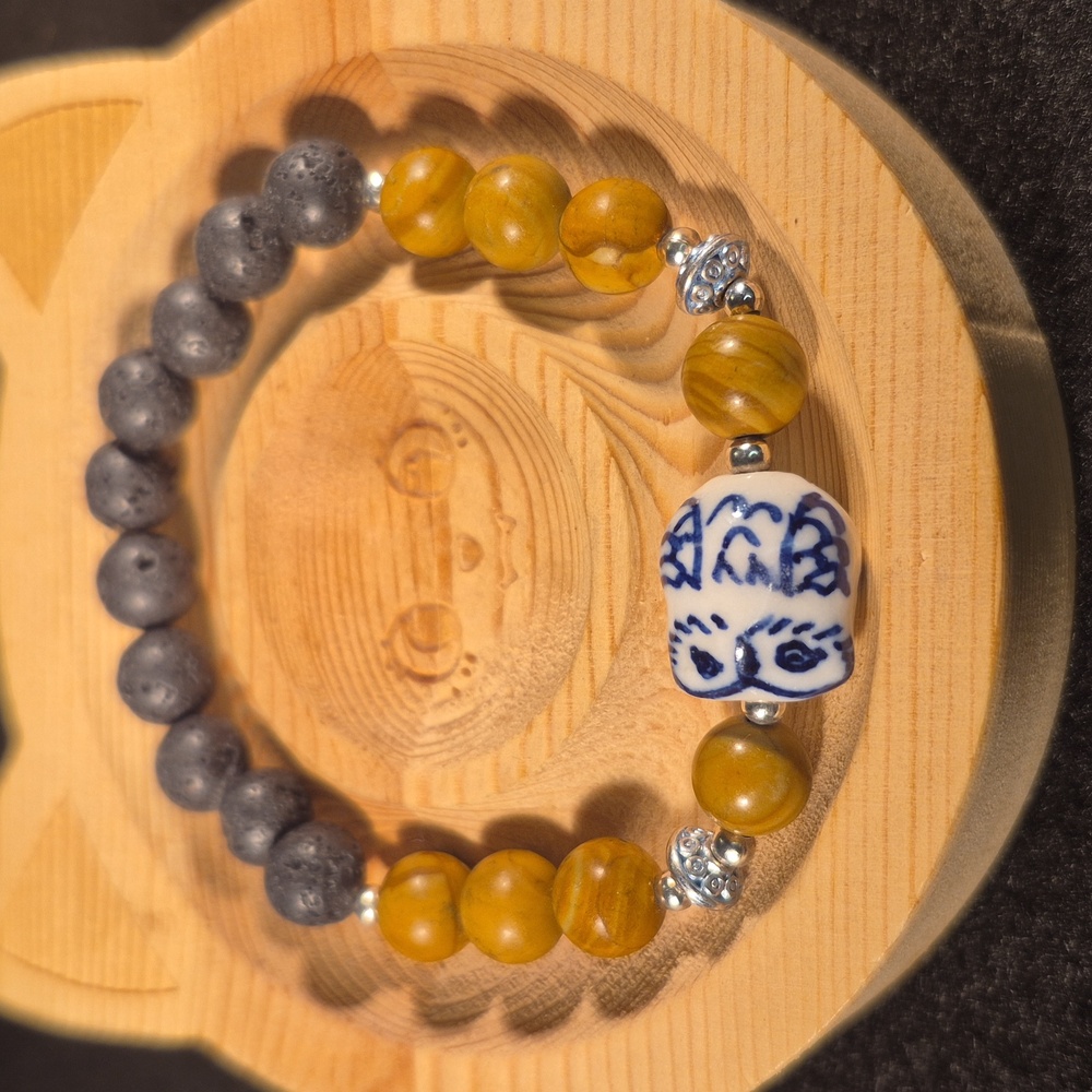 Petrified wood and ceramic owl lava bead bacelet